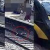 Toddler Saved from Train Tracks After Falling Seconds Before it Thundered Past